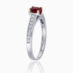 0.47 Carats Oval Cut Ruby Ring with Diamonds in 18 Karat White Gold