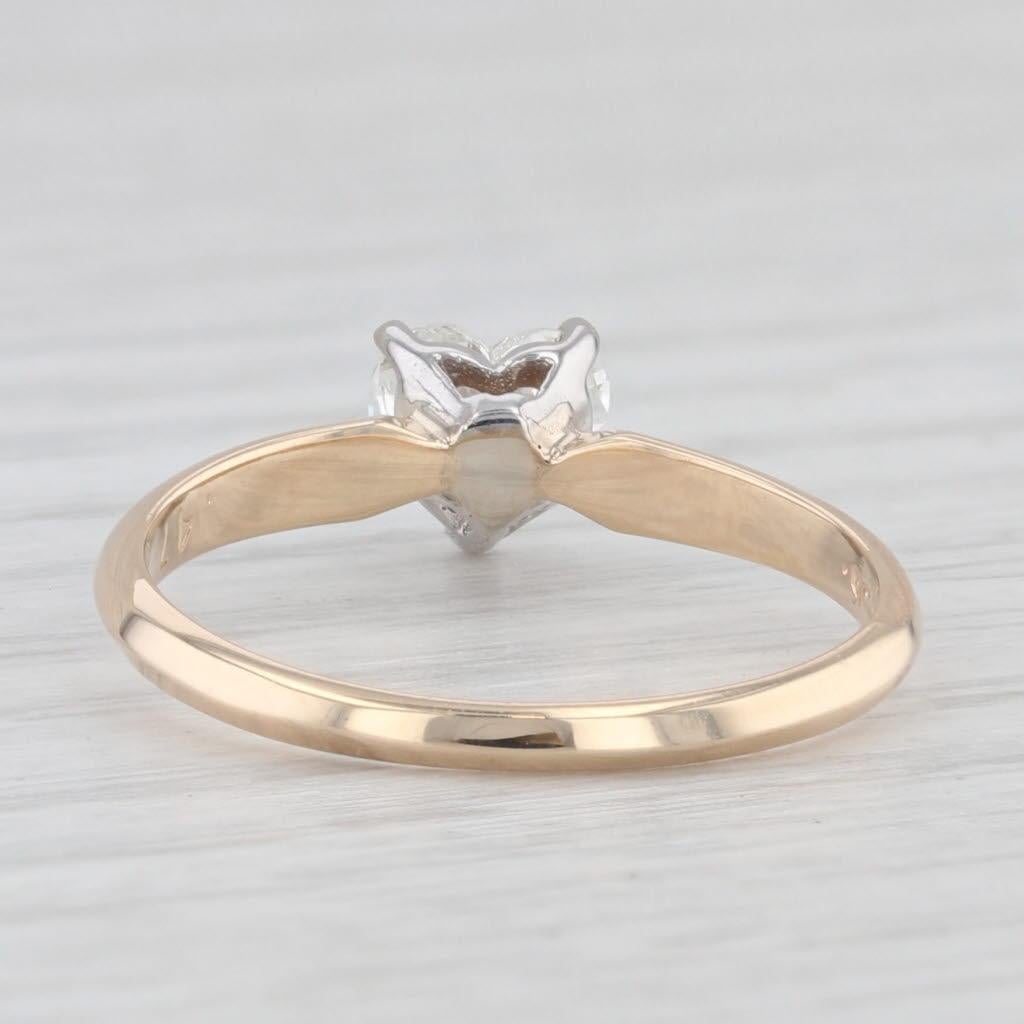 Gemstone Information:
- Natural Diamond -
Carats - 0.47ct 
Cut - Heart Brilliant
Color - G
Clarity - SI2

Metal: 14k Yellow Gold, White Gold Setting
Weight: 1.8 Grams 
Stamps: 14k
Face Height: 5.7 mm 
Rise Above Finger: 6 mm
Band / Shank Width: 1.7