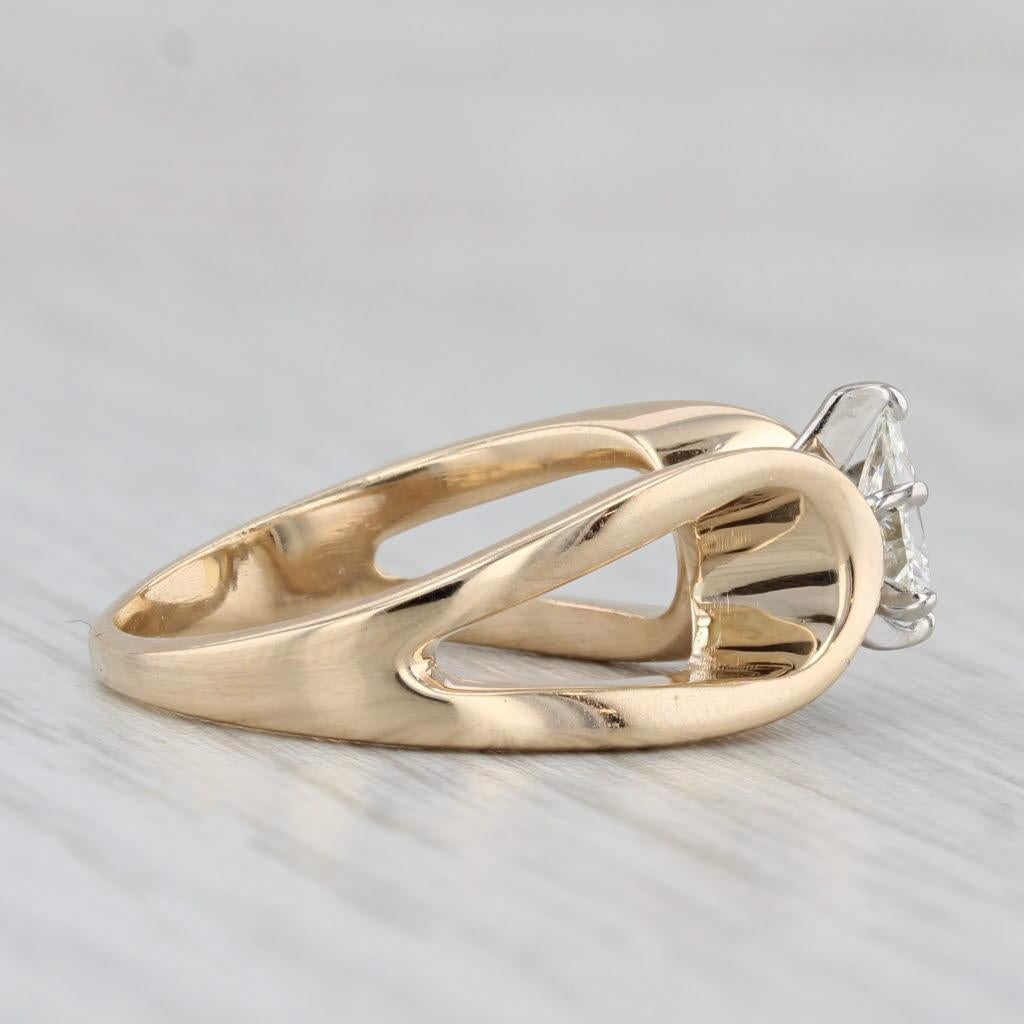 Gemstone Information:
- Natural Diamond -
Carats - 0.47ct 
Cut - Pear Brilliant
Color - K - L
Clarity - VS2

Metal: 14k yellow gold, white gold settings
Weight: 5.3 Grams 
Stamps: 14k
Face Height: 8.4 mm 
Rise Above Finger: 7.4 mm
Band / Shank