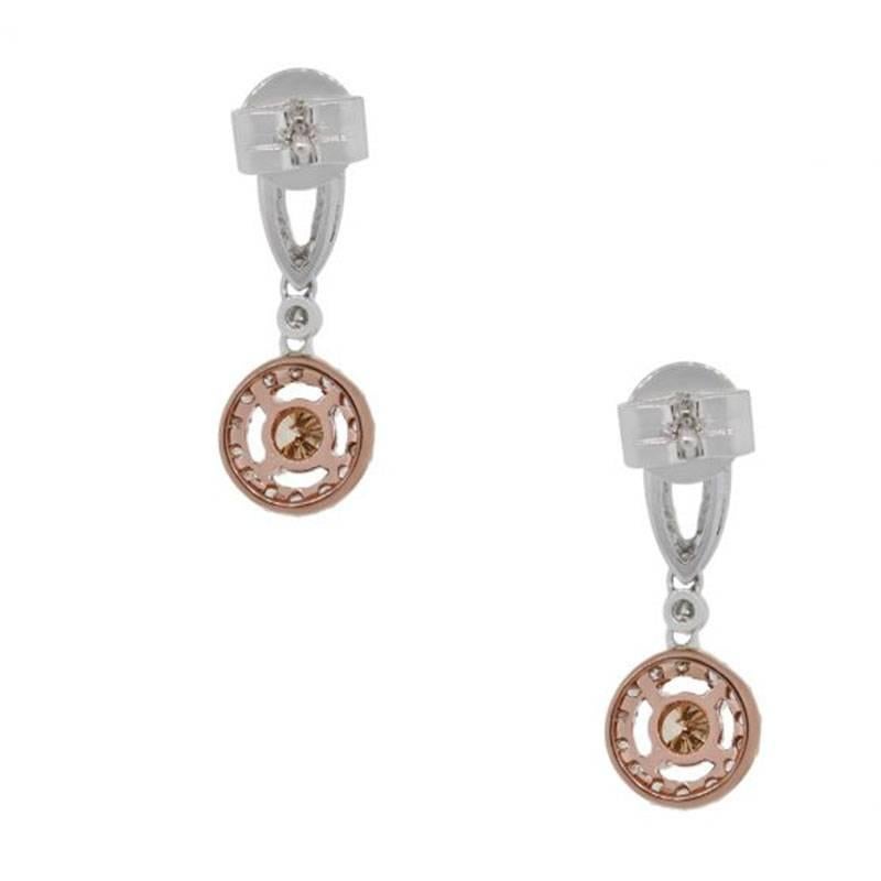 Style: Warm champagne diamond dangle earrings
Material: 14k white and rose gold
Diamond Details: Approximately 0.35ctw of warm champagne diamonds
Approximately 0.48ctw round brilliant diamonds. Diamonds are G/H in color and SI in clarity.
Earring