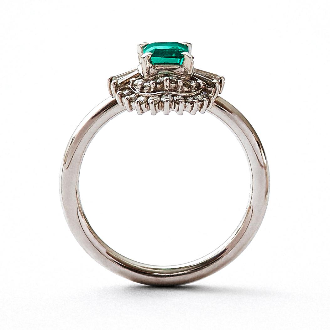 This is a luxurious, one-of-a-kind platinum cocktail ring that combines a repurposed vintage high jewelry stone setting with a round ring band. This rare and classic three-tier setting was made by highly skilled craftsmen and features a step cut