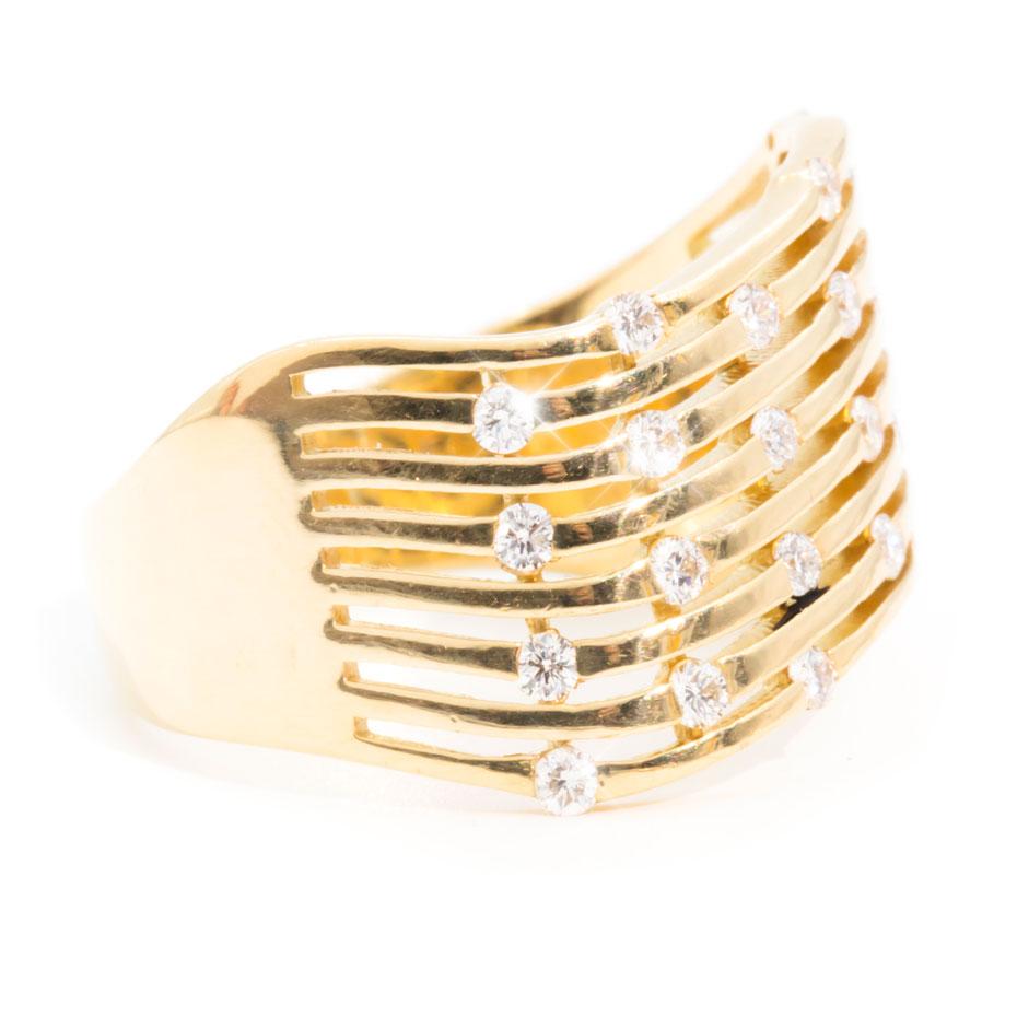 Forged in 18 carat yellow gold is this uniquely designed vintage diamond band ring embellished with a plethora of glittering round brilliant cut diamonds.  We have named this charming vintage ring The Lady Ring.  The Lady Ring fits low to the finger