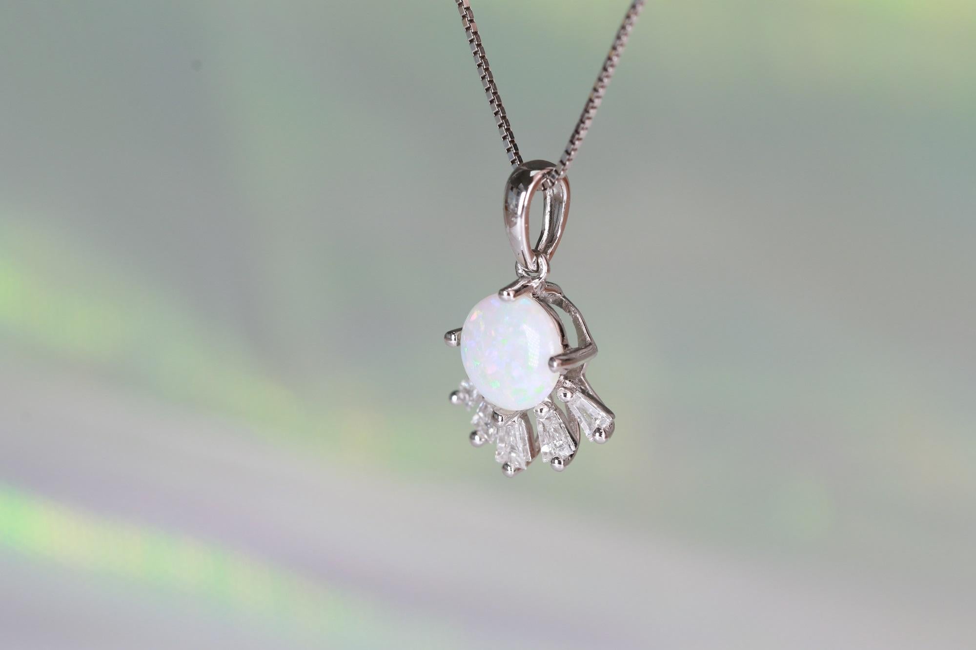 Stunning, timeless and classy eternity Unique Pendant. Decorate yourself in luxury with this Gin & Grace Pendant. The 18k White Gold jewelry boasts Round Cut Prong Setting Genuine Ethiopian Opal (1 pcs) 0.48 Carat, along with Natural Baguette cut