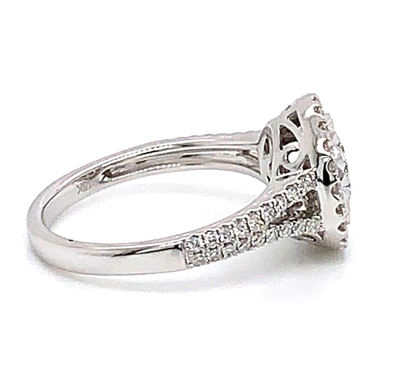 This 0.48 Carat Round White Diamond Ring from Shimon's Creations is designed to sparkle at every angle. The white diamonds join with the white gold in the middle of the ring to create a beautiful one-of-a-kind design. The white diamonds are also set