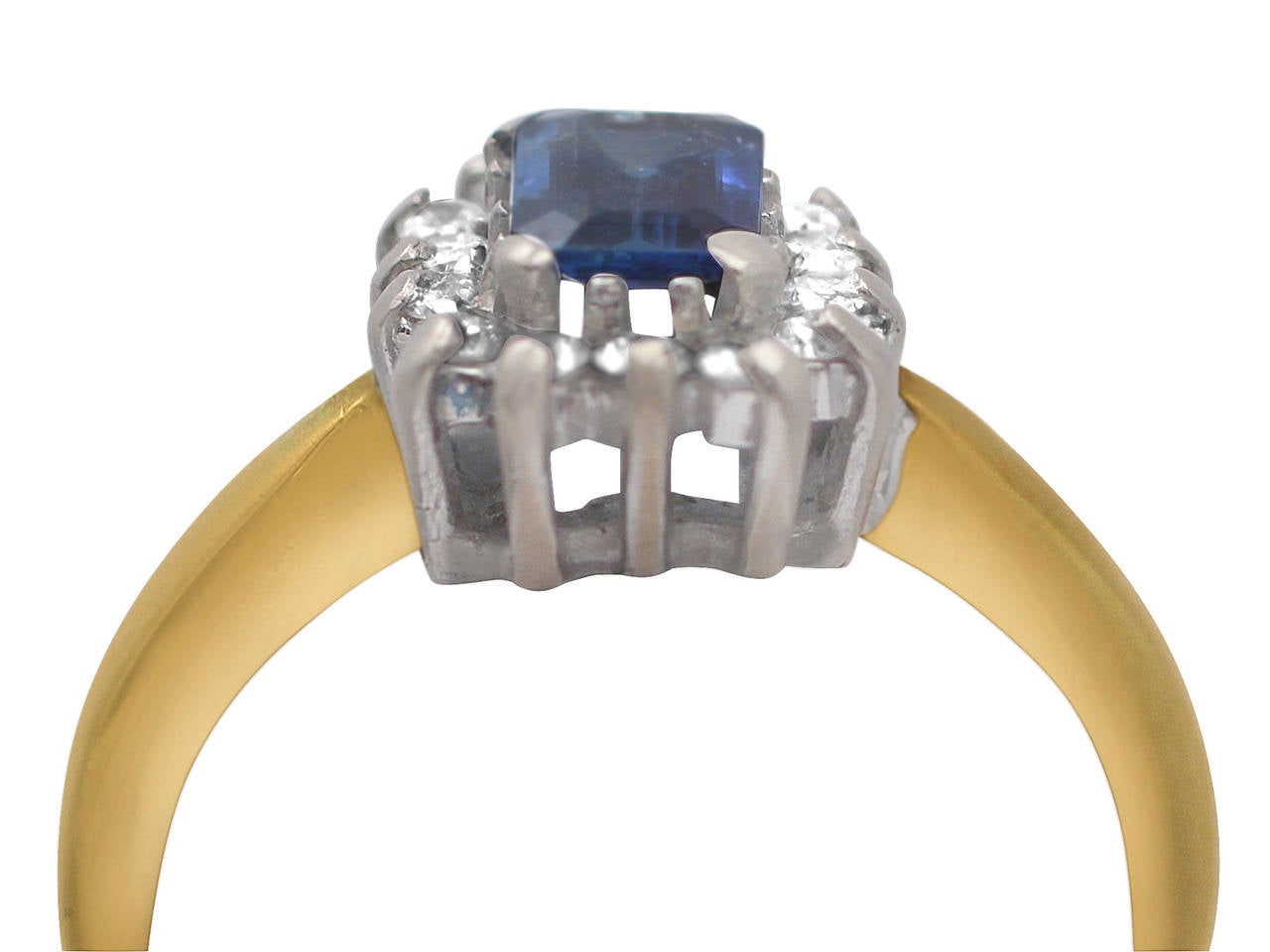 A very good vintage 0.48 carat natural blue sapphire and 0.35 carat diamond, 18 karat yellow gold, platinum set cluster ring; part of our vintage jewelry/estate jewelry collections

This vintage sapphire and diamond ring has been crafted in 18k