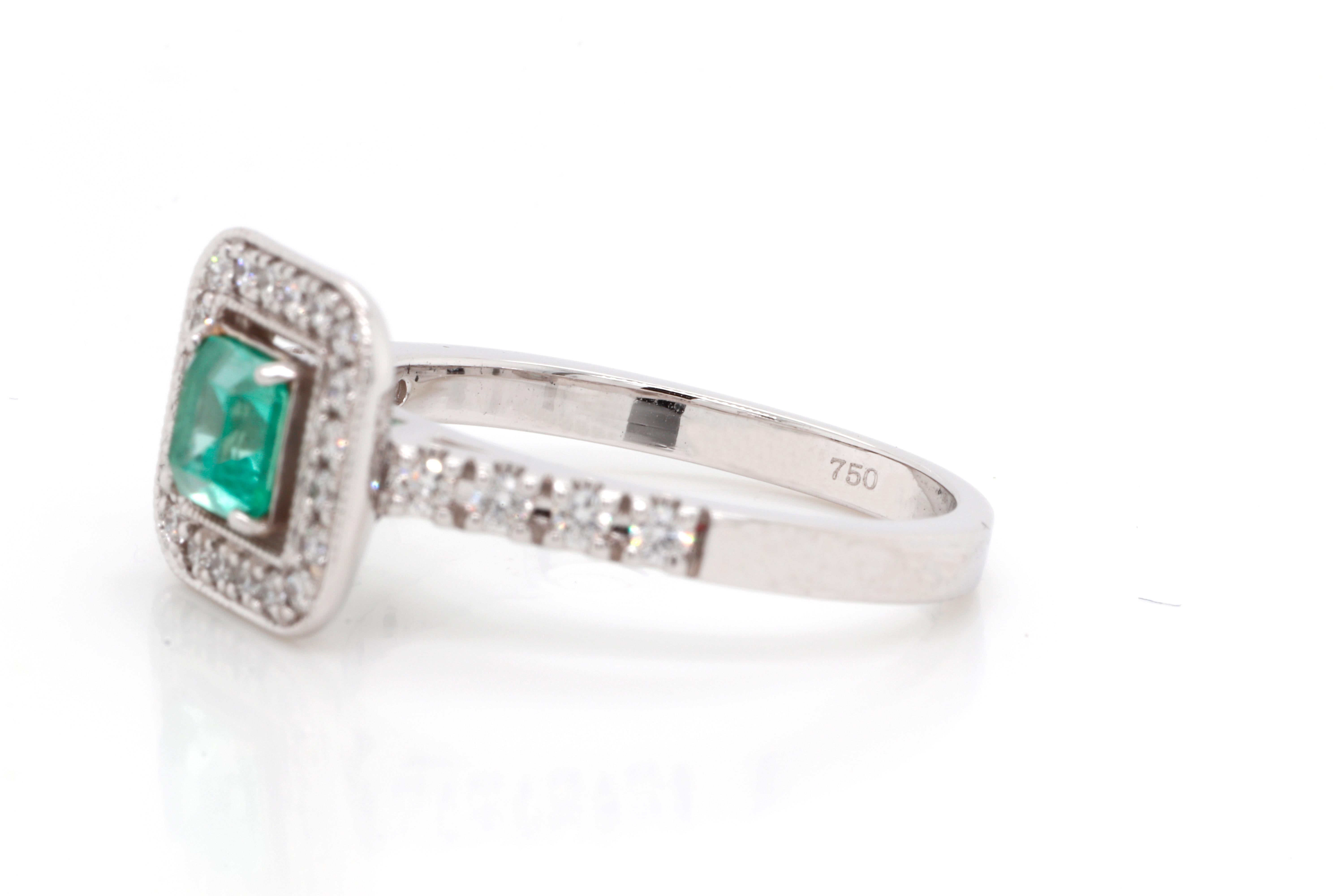 Classic 0.48 ct Emerald White Gold Ring accented with natural 0.32 ctw Diamonds G-H color and VVS1 clarity. This eye-catching ring is perfect for everyday wear and for any speciall occasion. It can also be used as engagement or wedding ring.
