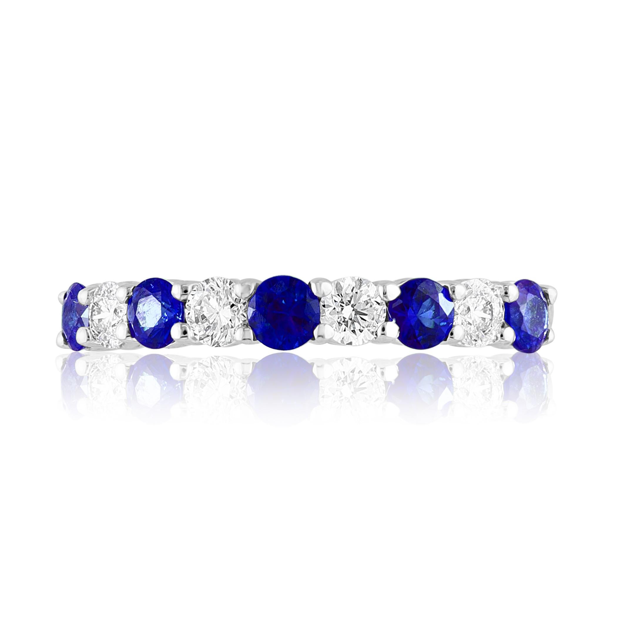A fashionable and classic wedding band showcasing 4 brilliant cut diamonds weighing 0.37 carats total alternating with 5 round blue sapphires weighing 0.49 carats. Stones secured with a shared 4 prong setting made with 14K white gold. A versatile