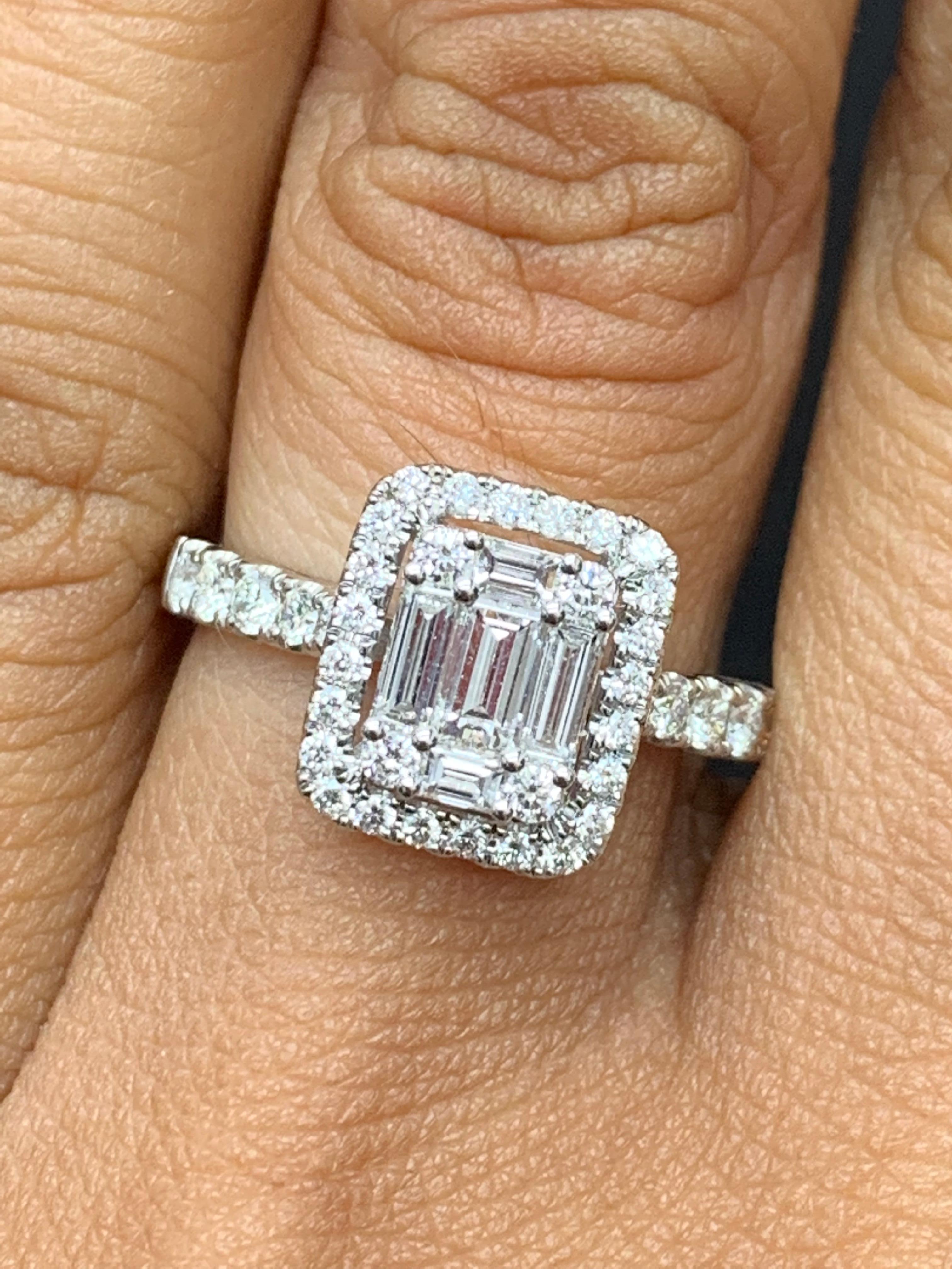 A brilliant and unique piece featuring a cluster of baguette diamonds shaped like an emerald cut, surrounded by a single row of round brilliant diamonds with a split shank. 5 Baguette diamonds weigh 0.49 carats total; 39round diamonds weigh 0.50