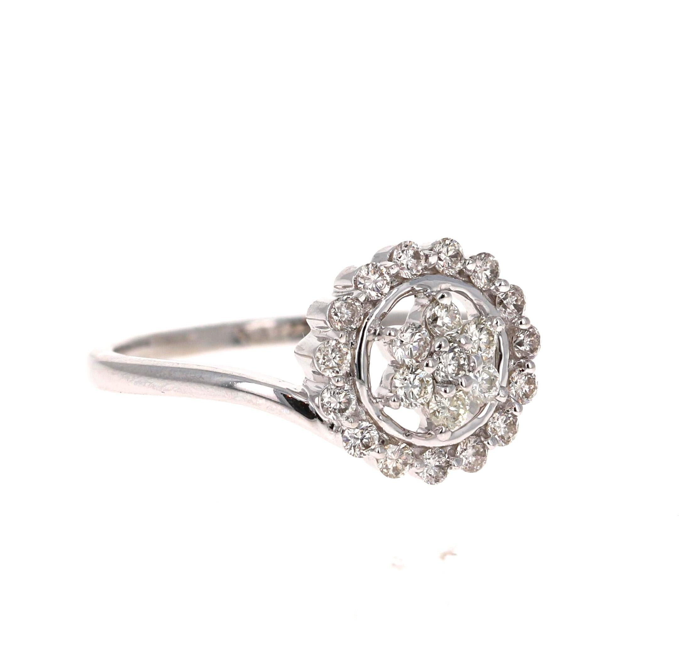 This unique Cluster ring has 22 Round Cut Diamonds that weigh 0.49 Carats.  The Cluster setting makes the center Diamond look well over a carat.   The Clarity is VS2 and the Color is H.

It is beautifully set in 14 Karat Yellow Gold and weighs