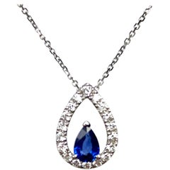 DiamondTown 0.49 Carat Pear Shape Sapphire and 0.25 Carat Diamond Halo Cutout