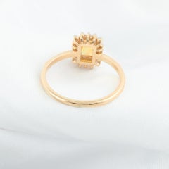 0.49 Carat Yellow Sapphire 0.12 Carat SI/H Diamond Ring 14 Karat Yellow Gold