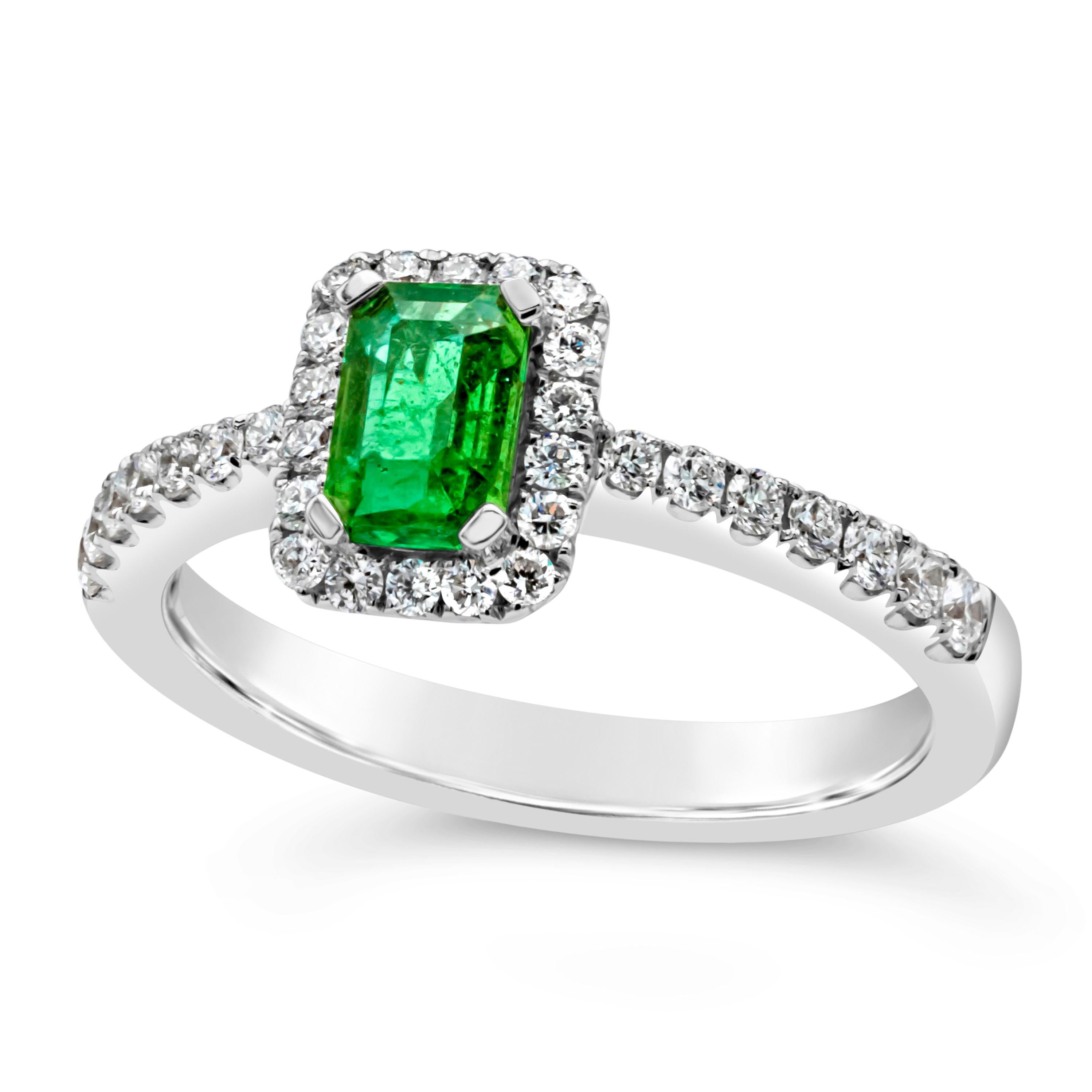 Contemporary 0.49 Carats Total Emerald Cut Green Emerald & Diamond Halo Engagement Ring For Sale
