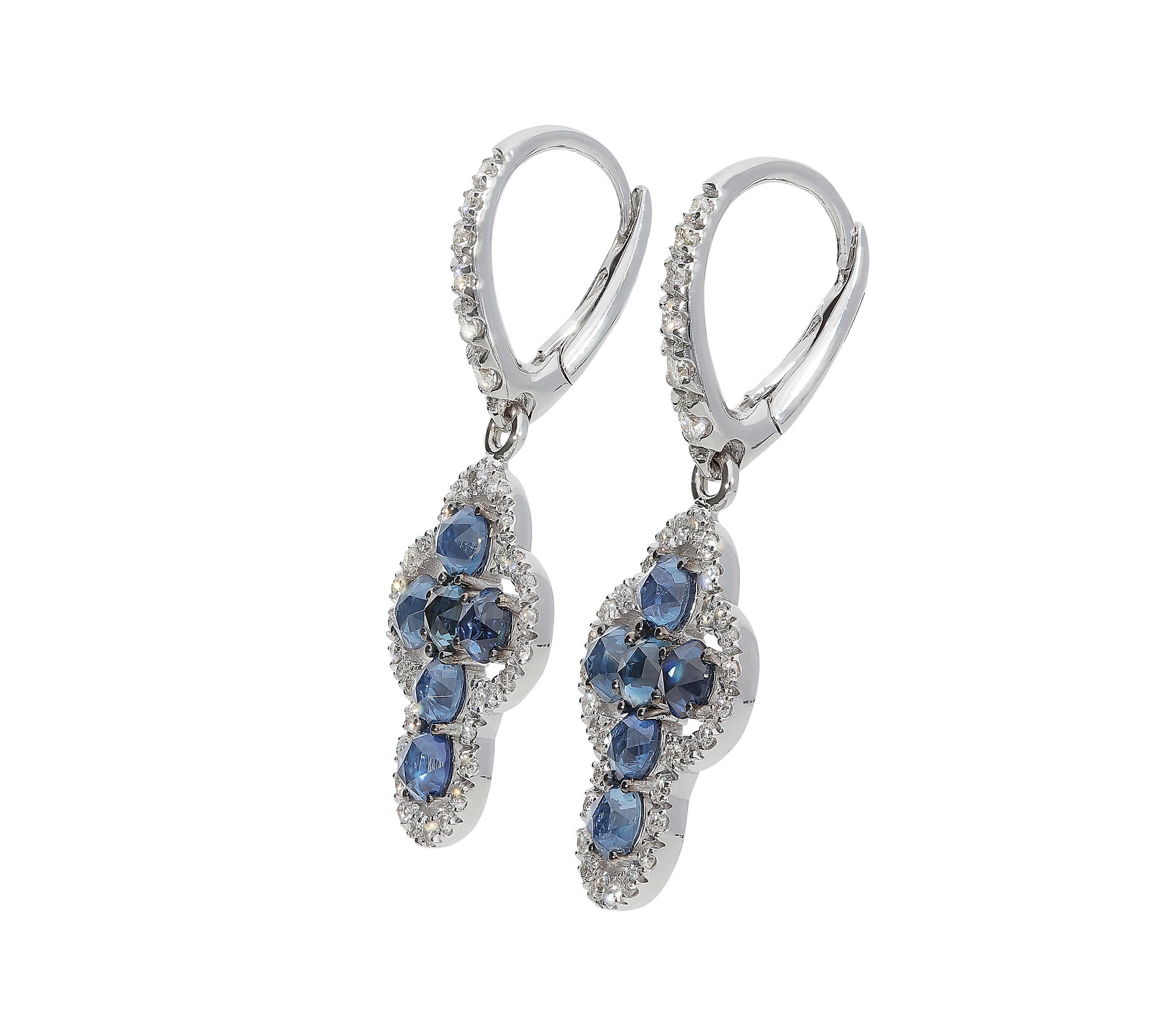 Rose cut blue sapphires for 1,58 carats and white round brilliant diamonds color G clarity VS for 0,49 carat set on these dangle earrings. The weight of 18kt white gold is 4,10 grams and the total length is 2,80 centimeters and the width is 1,20