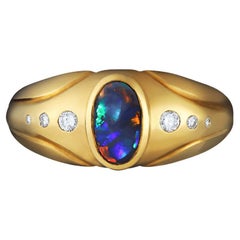 0.49ct Australian Black Opal, Diamond 
18K Yellow Gold Ring
