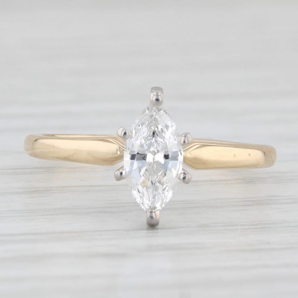 Gemstone Information:
- Natural Diamond -
Carats - 0.49ct 
Cut - Marquise
Color - G - H
Clarity - VS2

Metal: 18k Yellow Gold Band, Platinum Setting
Weight: 2.3 Grams 
Stamps: 18k Pt
Face Height: 9.6 mm 
Rise Above Finger: 7 mm
Band / Shank Width: