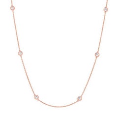Collier croix en or rose 14 carats et diamants 0,5 carat