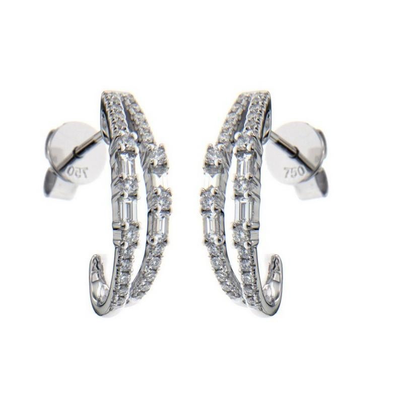 Diamond Carat Weight: These exquisite earrings feature a total of 0.5 carats of diamonds. The ensemble consists of 54 round-cut diamonds and 8 baguette-cut diamonds, each chosen for their brilliance and quality.

Gold Composition: Crafted in 14K