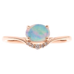 0.5 Carat Oval Cut Ethiopian Opal Diamond accents 10K Rose Gold Ring.