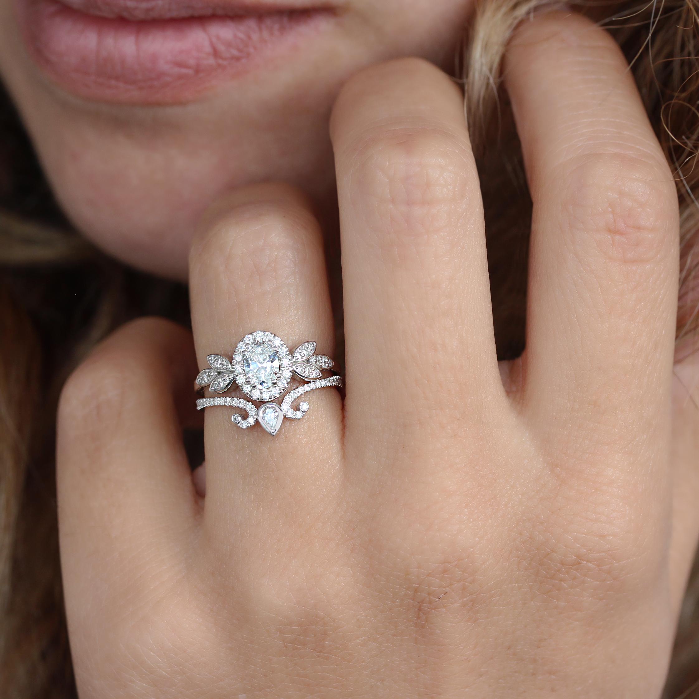 Floral oval diamond halo unique engagement ring - Minimal Lily.
The canter stone in the video is 1.0 carat.
This list is for the engagement ring only.
Handmade with care. 
An original design by Silly Shiny Diamonds. 

Details:
* Center stone shape: