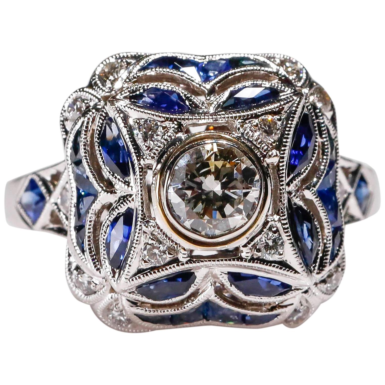 0.5 Carat Sapphire 0.7 Carat Diamond 18K White Gold Engagement Ring New Art Deco Style

Crafted in 18kt White Gold, this Unique design showcases a Blue Sapphire 0.5 TCW, set in a halo of round-cut mesmerizing diamonds, Polished to a brilliant