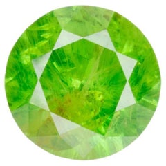 0.5 ct Faceted Russian Demantoid Garnet With Bissolite Inclusions