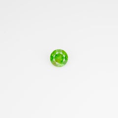 0.5 ct, Faceted Russian Demantoid with bissolite inclusions