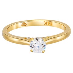 0.5 ct solitaire moissanite 14k gold ring.