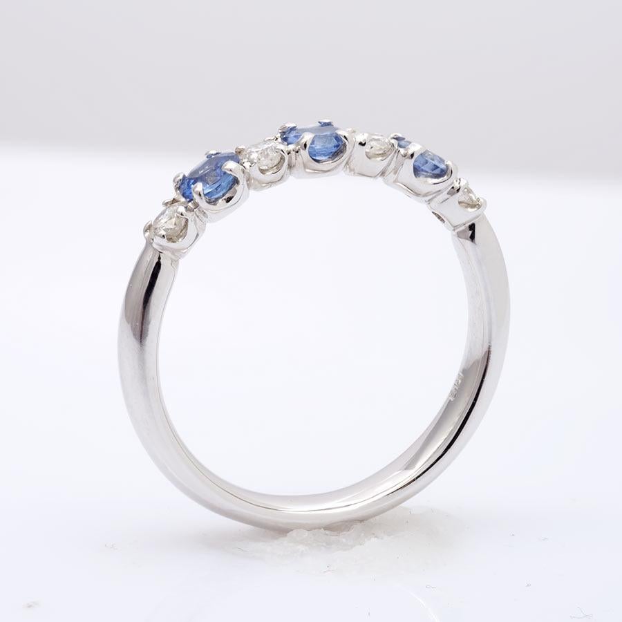 Perfectly balanced, this ring features 0.50 carats of beautifully matched Sapphires set in 18K white gold. Each gem is held in place by secure yet hidden prongs that enhance the sophistication of the ring. The cool colors of the ring will be a great