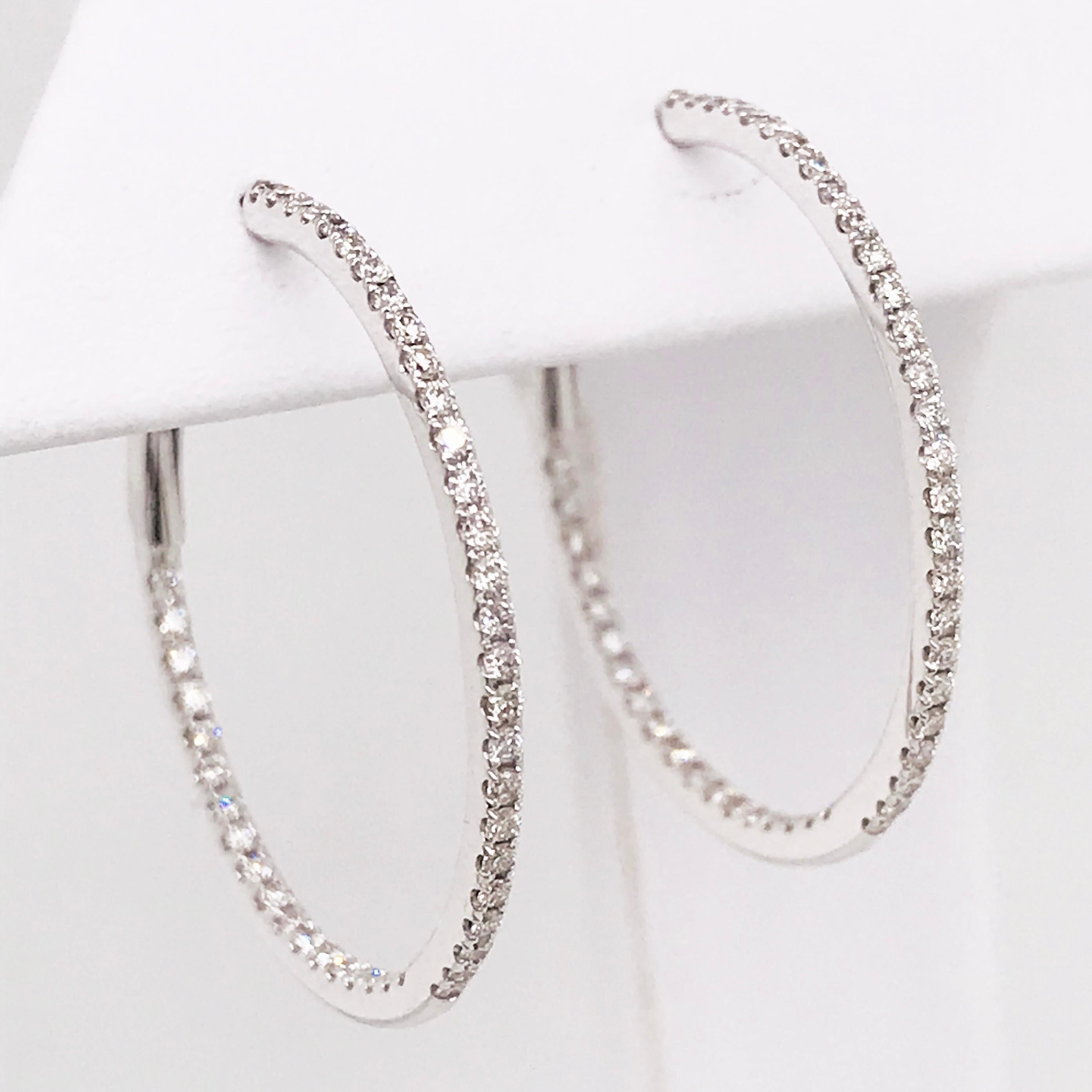 These diamond inside out hoops are a staple in any fine jewelry collection. The 1 1/2 inch diameter is a perfect size for any occasion. They can be worn casually or for a more formal event. 

The hoops have round brilliant diamonds covering the top