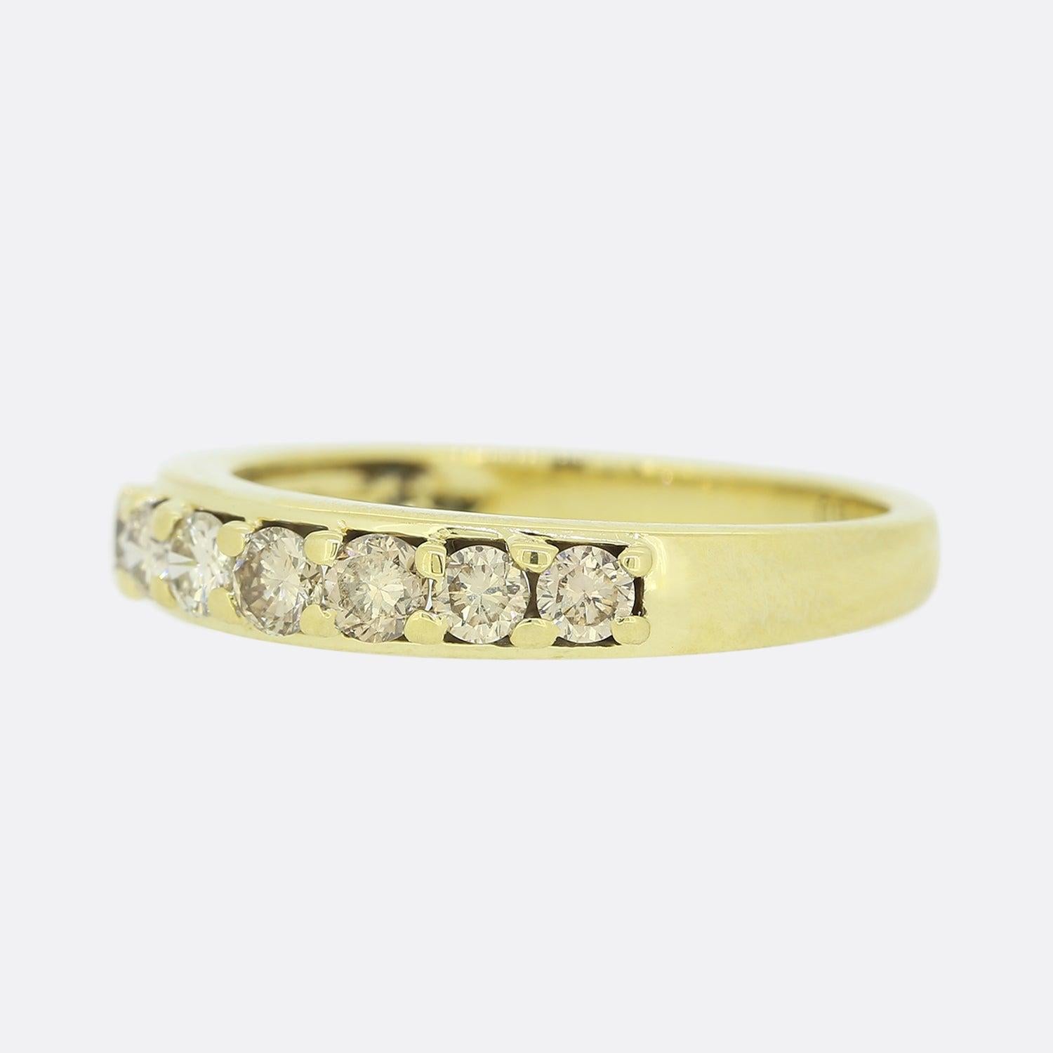 This is an 18ct yellow gold diamond seven stone ring. The ring features seven natural cognac coloured round brilliant cut diamonds which have been claw set in 18ct yellow gold with a plain polished band.

Condition: Used (Very Good)
Weight: 3.2