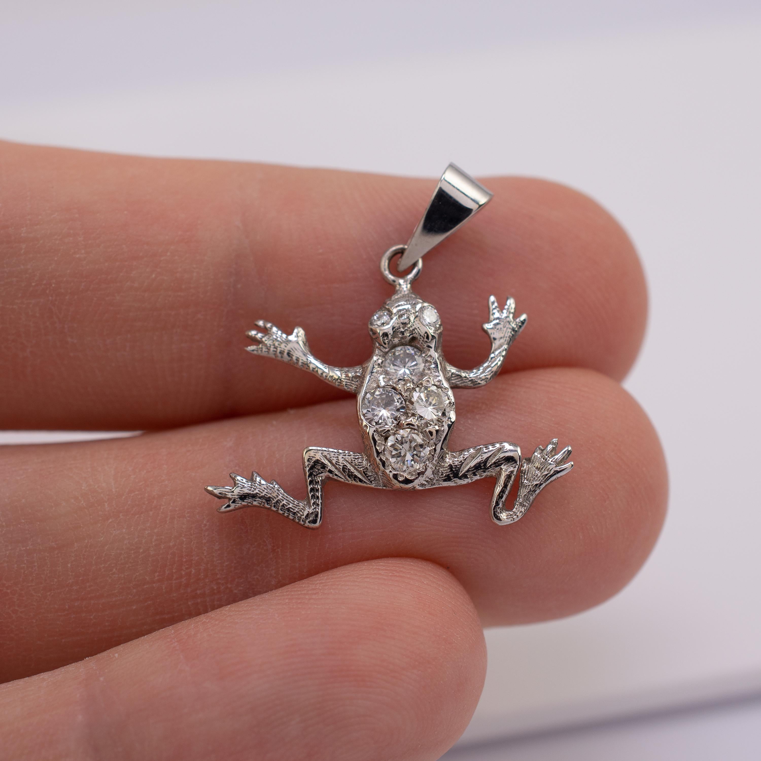 This diamond Frog pendant is beautifully made in 15 karat white gold and features 0.50 carats of round cut diamonds.

This outstanding piece is realistically modeled as a dimensional frog with a textured finish to the front and a smooth reverse.