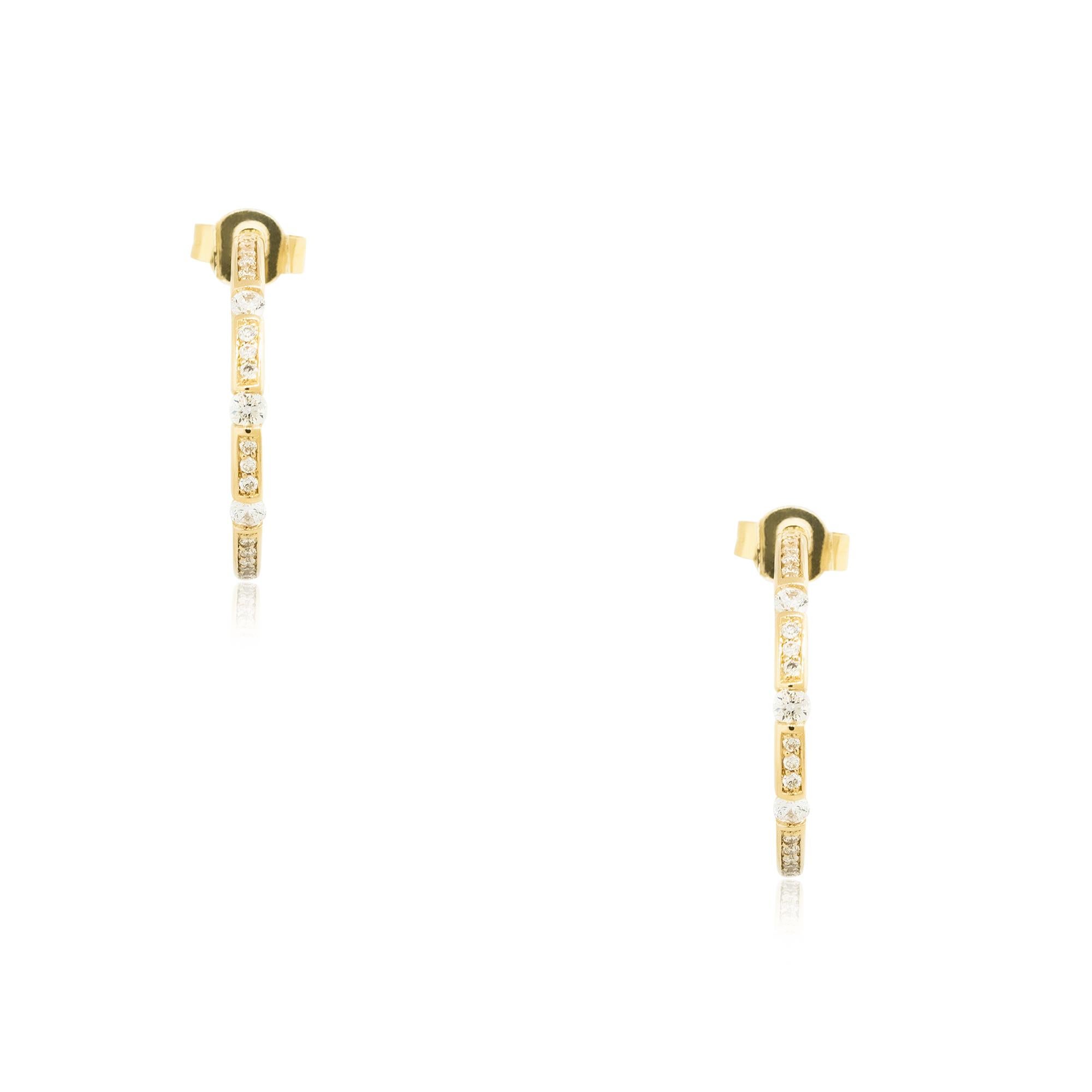 Material: 18k Yellow Gold
Diamond Details: Approx. 0.50ctw of round cut Diamonds. There are 3 larger Diamond stations and smaller Diamonds set throughout the stations. Diamonds are I/J in color and SI in clarity
Total Weight: 3.3dwt 
Earring Backs: