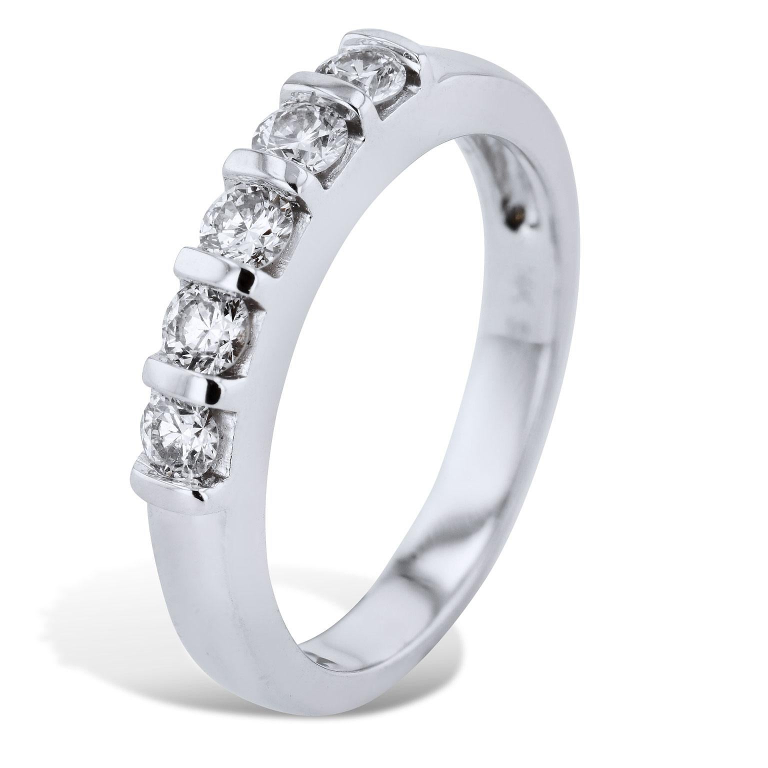 Estate 0.50 Carat White Diamond and 14 karat White Gold Band Ring

0.50 carats of round brilliant cut diamond (J/K/SI2) are bar set and affixed to a 14 karat white gold shank. 
This previously loved band ring provides a spectrum of light and color