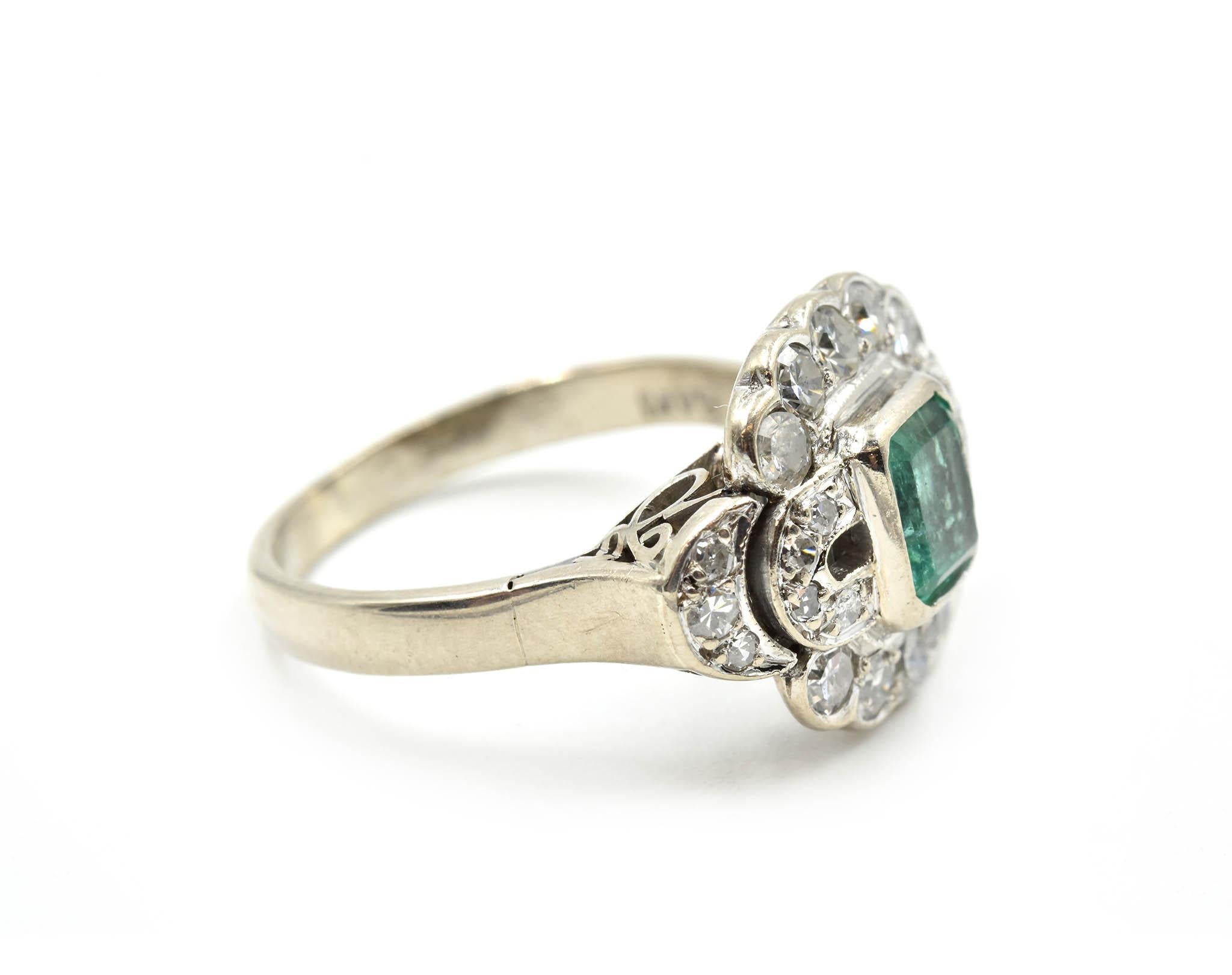Designer: custom design
Material: 14k white gold
Emerald: emerald cut 0.50 carat weight emerald
Diamonds: 24 round brilliant cuts = 0.64 carat weight
Dimensions: ring top is a 1/2-inch long and a 5/8 inch wide
Ring Size: 7 (please allow two extra