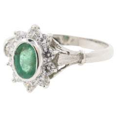 0.50 Carat Emerald and Diamonds Set on an 18 Karat White Gold Ring