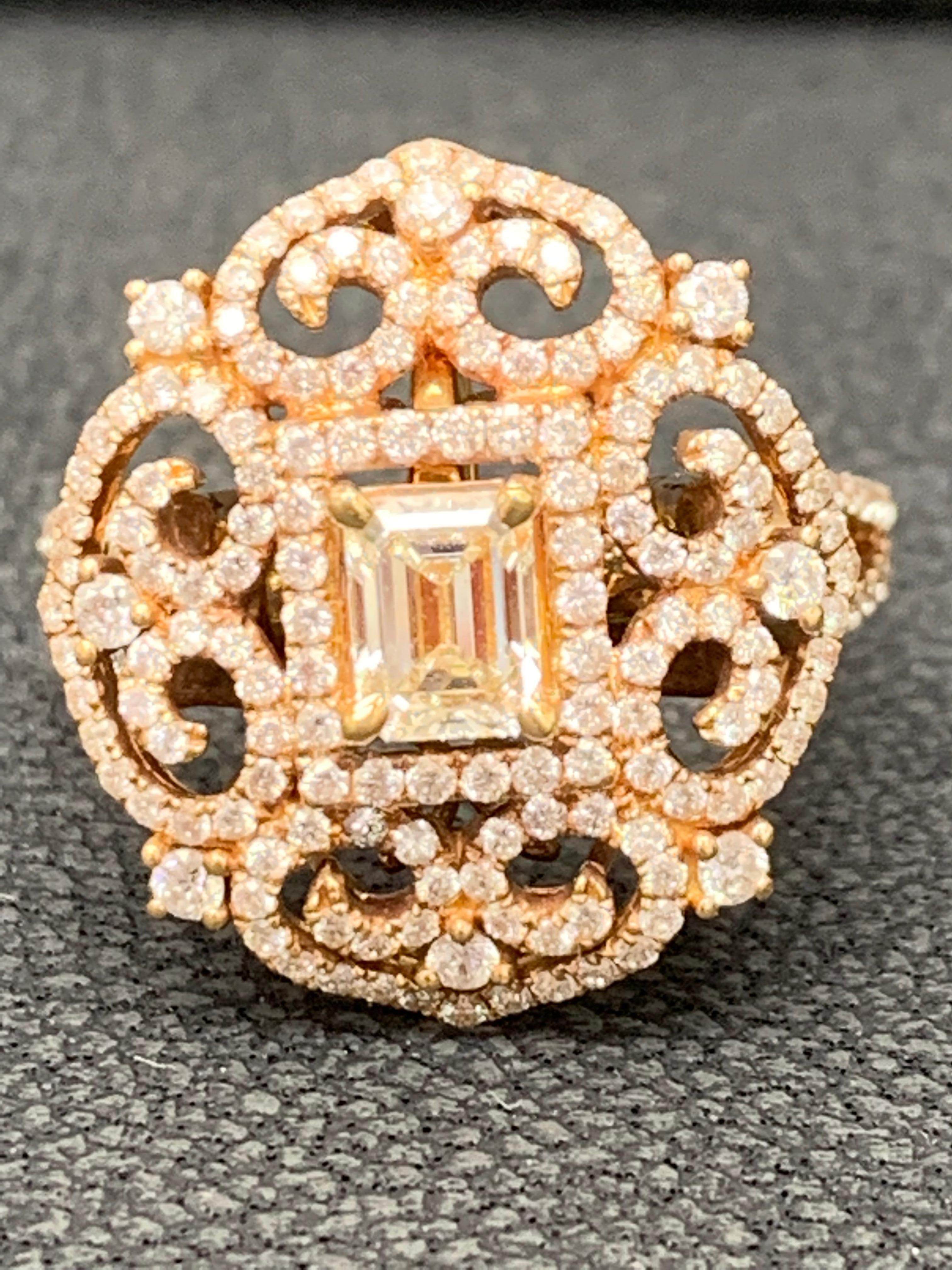 This ring showcases 0.50 carats of emerald cut diamond in the center and 0.94 carats of brilliant-cut round diamonds, set in a fashionable open-work design. Its a 2 in 1 design. can be worn as a ring and pendant both. Made in 18 karats rose gold.