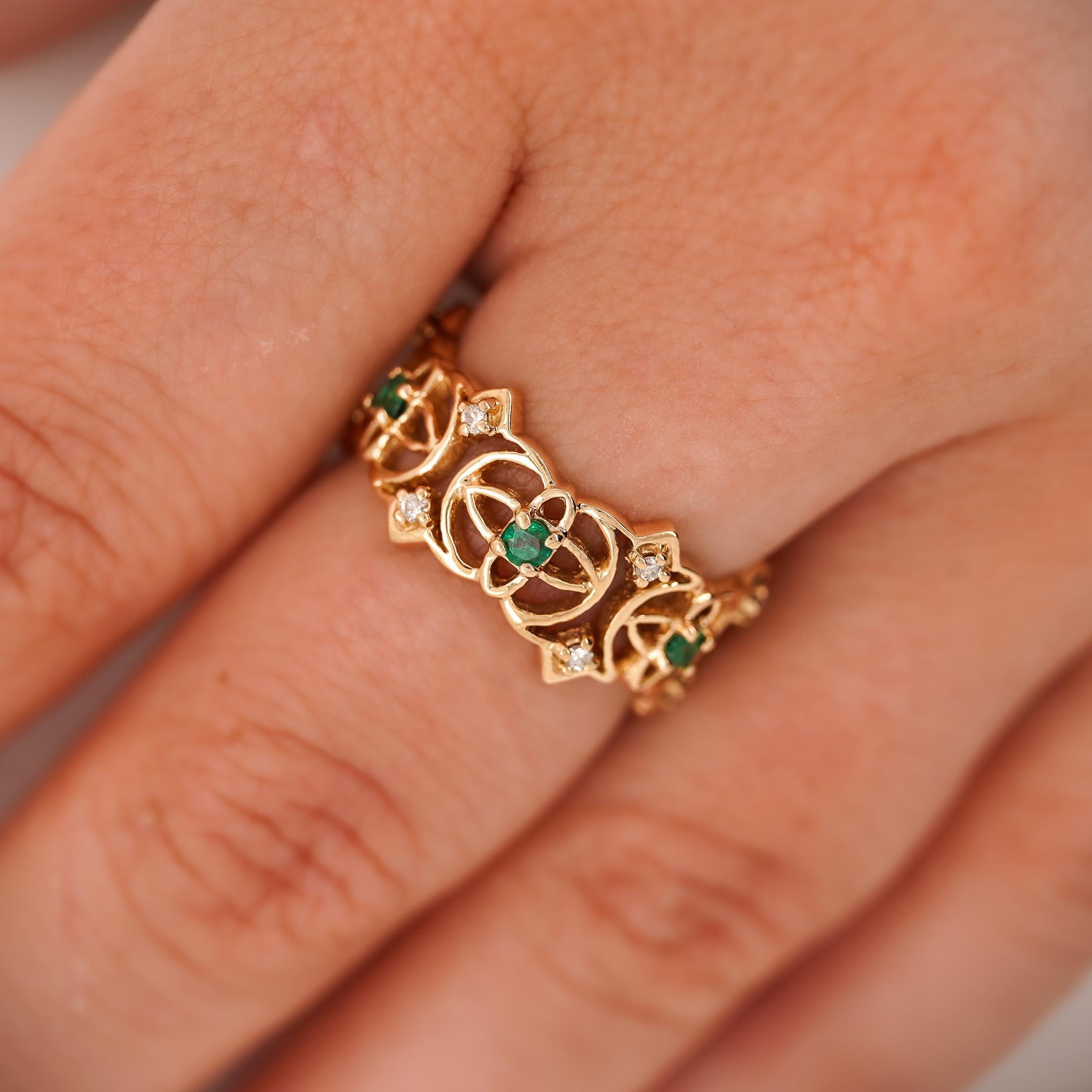 1/2 Carat total open gap emerald and diamond geometric band ring in 14k yellow gold.

Ring size 6.75, adjustable (USA size).

Details:
Item Type: Band Ring
Metal: 14K Yellow Gold (solid)
Size: 6.75 (adjustable)
Band Width: 9.5mm
Weight: 4.6