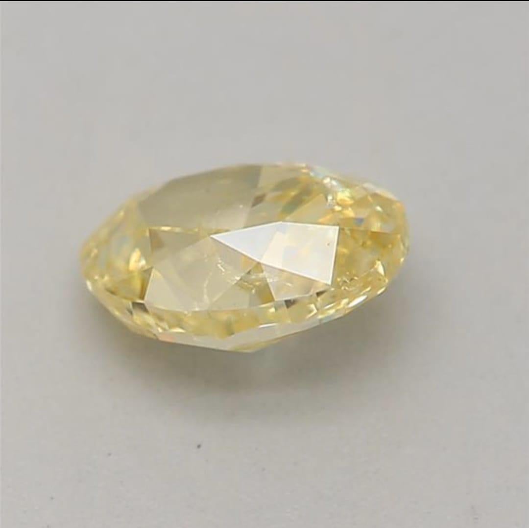 Women's or Men's 0.50 Carat Fancy Intense Yellow Oval shaped diamond I1 Clarity GIA Certified For Sale