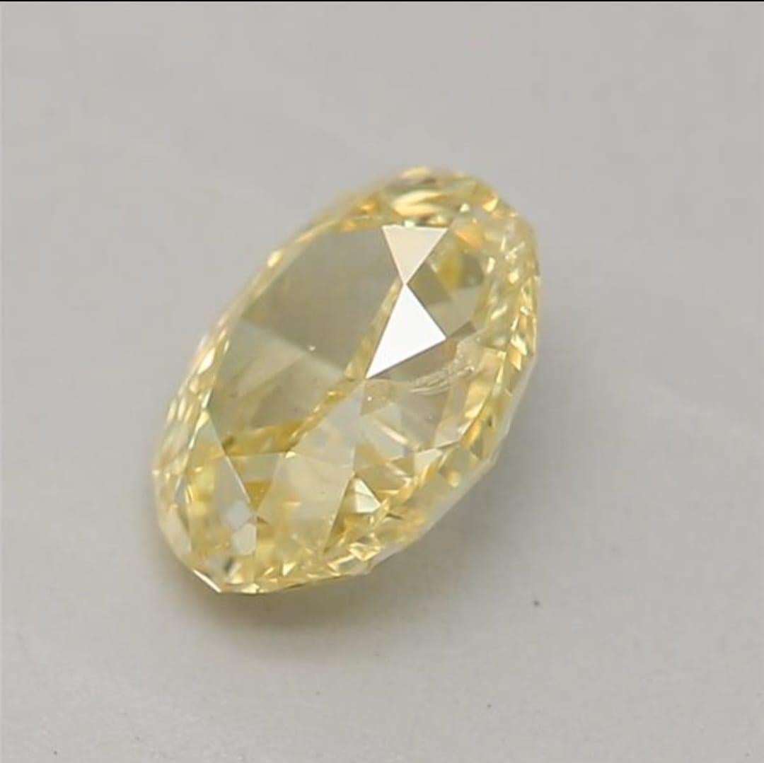 0.50 Carat Fancy Intense Yellow Oval shaped diamond I1 Clarity GIA Certified For Sale 1