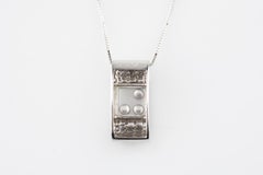 0.50 Carat Floating Diamonds Pendant Set in 14 Karat White Gold with Chain