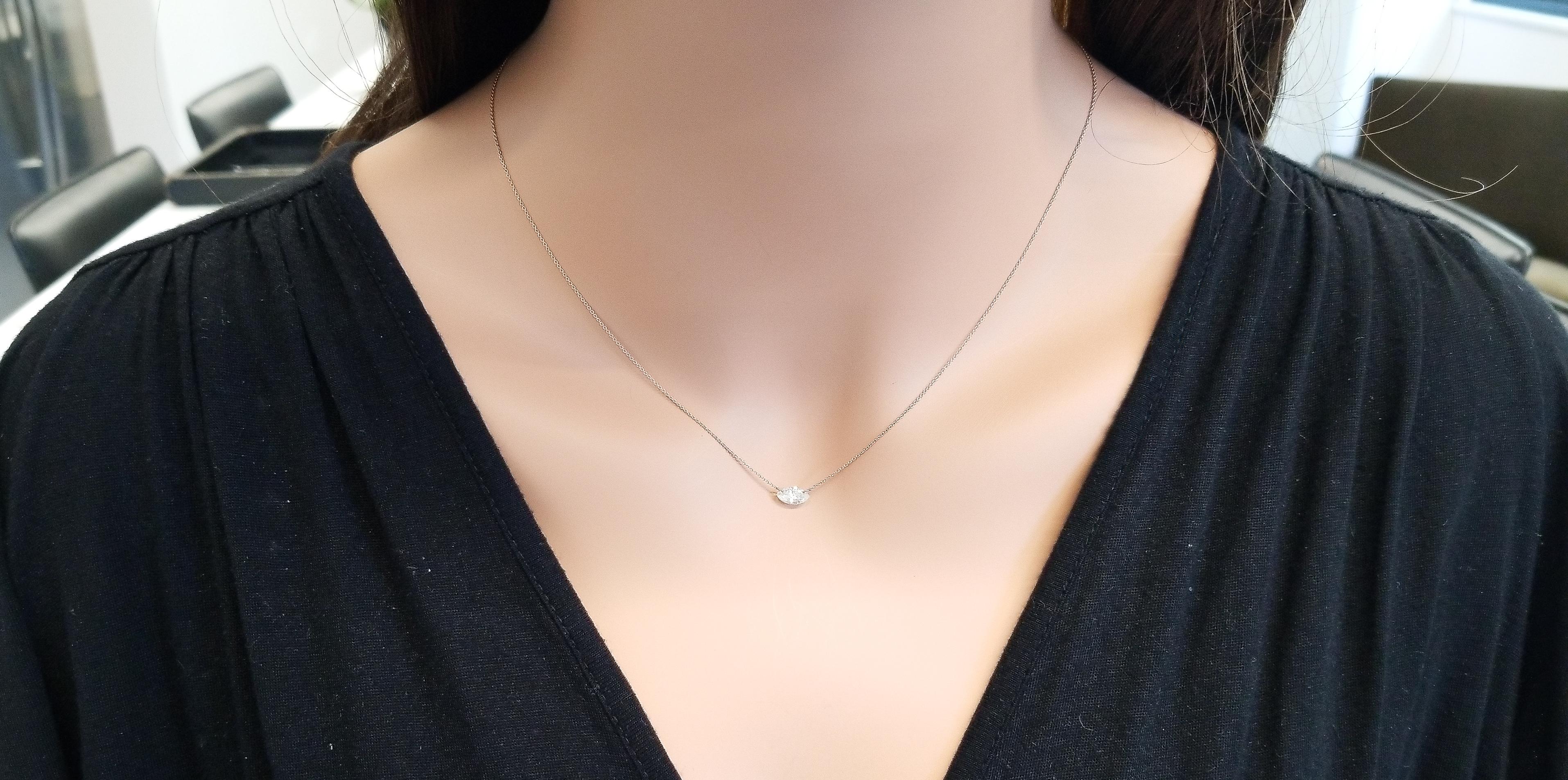 This gorgeous 14 karat rose gold diamond solitaire necklace is perfect for an anniversary or birthday present, truly unique in its remarkable presentation. A stunning 0.50-carat marquise diamond is drill set sideways on a shiny chain and has a