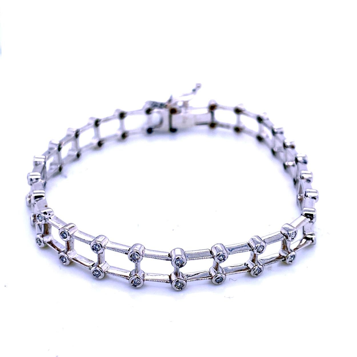 This Diamond Bracelet consists of 26 Links of Milgrained Edge Bezel Set Round Brilliant diamonds set in Platinum.   The bracelet comes with a  Built-in safety lock to protect it from loss. 
Total Weight of diamonds: 0.50 Ct 
Total Weight of