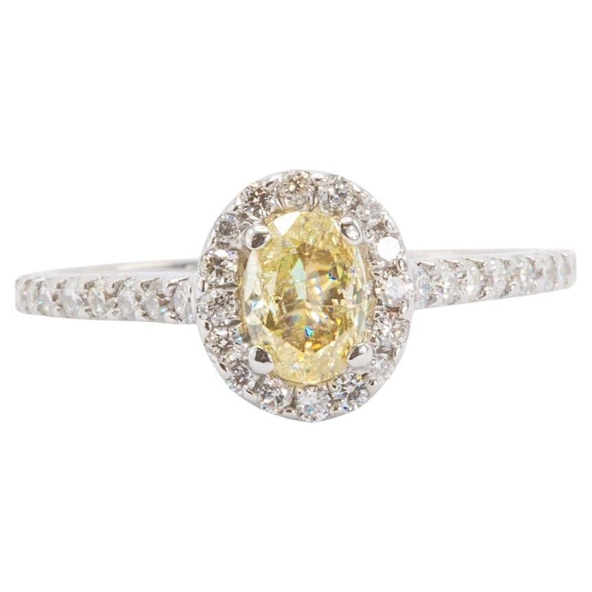 0.50 Carat Oval Cut Yellow Diamond in 18k White Gold Ring