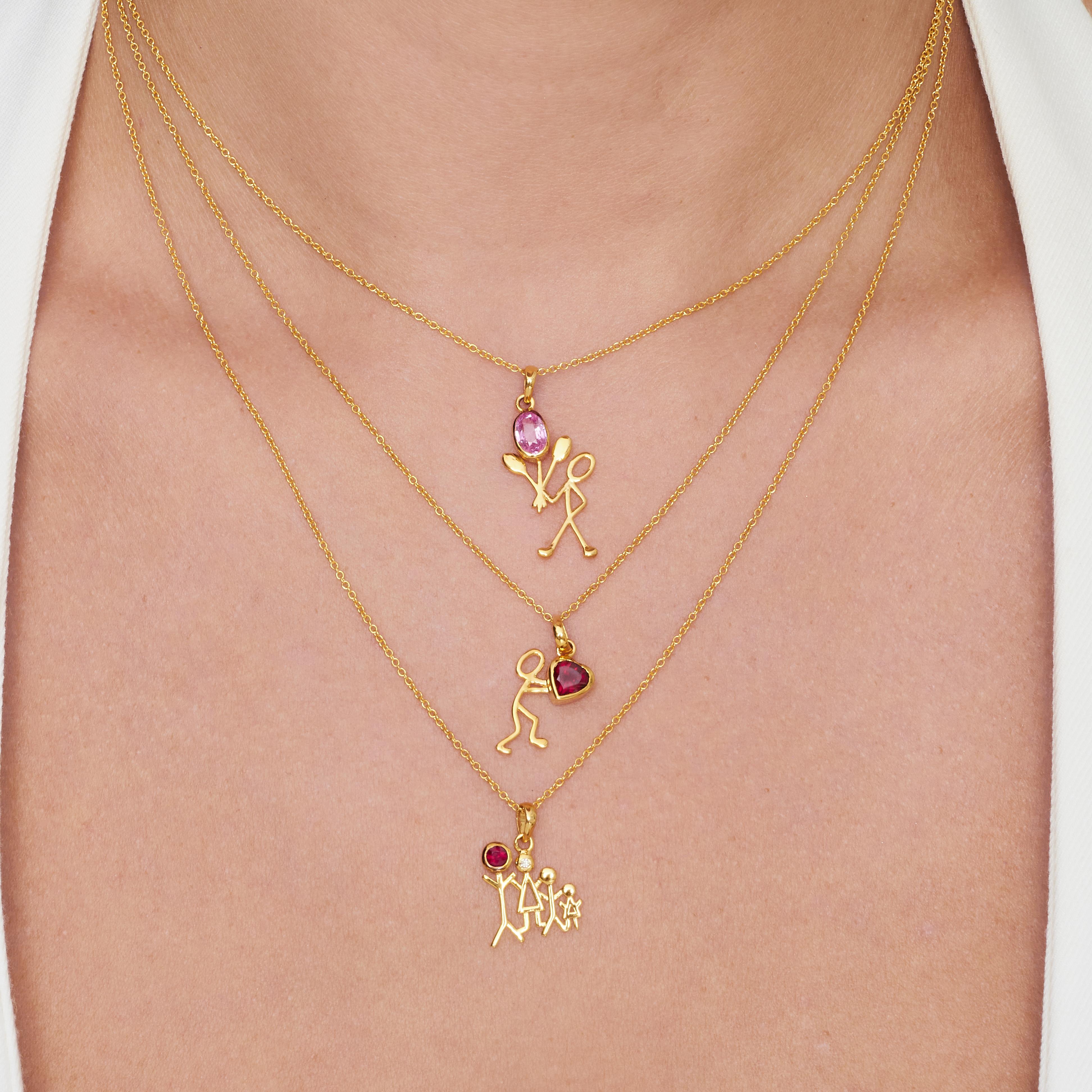 0.50 Carat Pink Sapphire Yellow Gold Stick Figure with Balloons Pendant Necklace.

This pendant necklace was handmade with 18-karat yellow gold. It features a 0.50-carat pink sapphire. This pendant is on an 18-inch chain necklace with a lobster