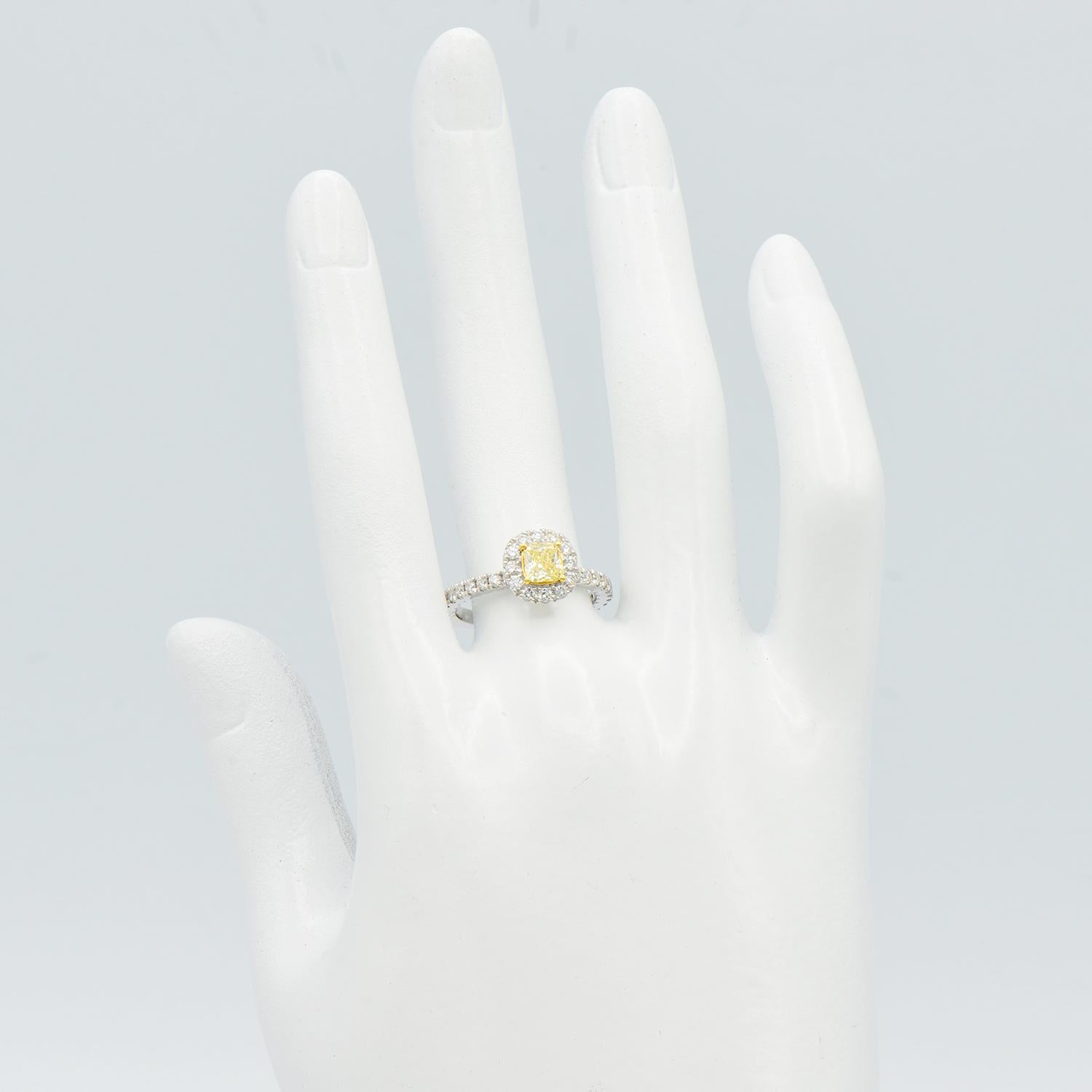 0.50 Carat Radiant Cut Yellow Diamond Ring with Diamond Halo and Band In New Condition In Great Neck, NY