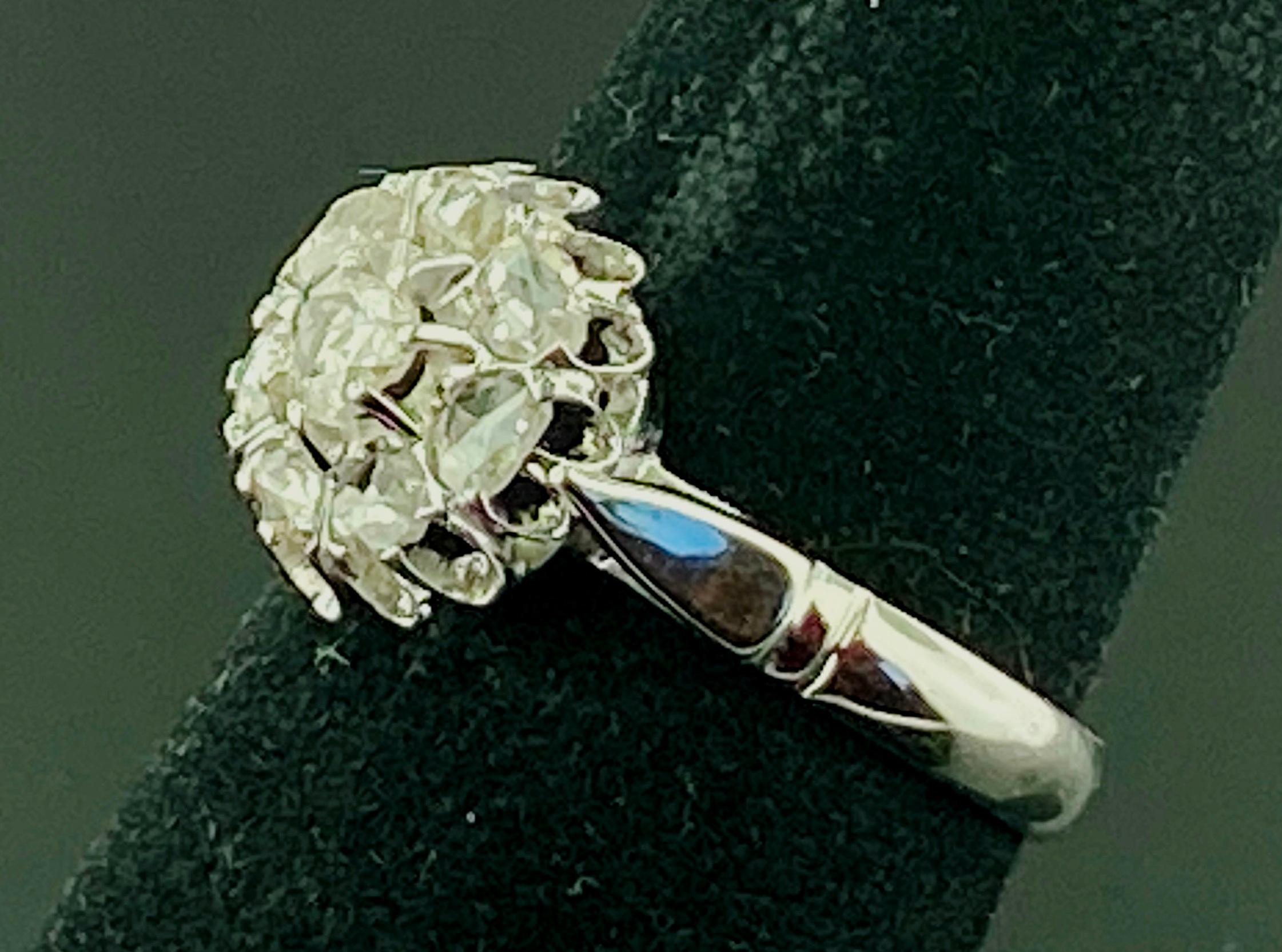 Set in 14 karat white gold, weighing 3 grams, are 8 Rose Cut diamonds weighing 0.50 carats.  Ring size is 8.25.