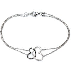 Bracciale in oro bianco 18 carati con diamante nero e brillante rotondo da 0,50 carati