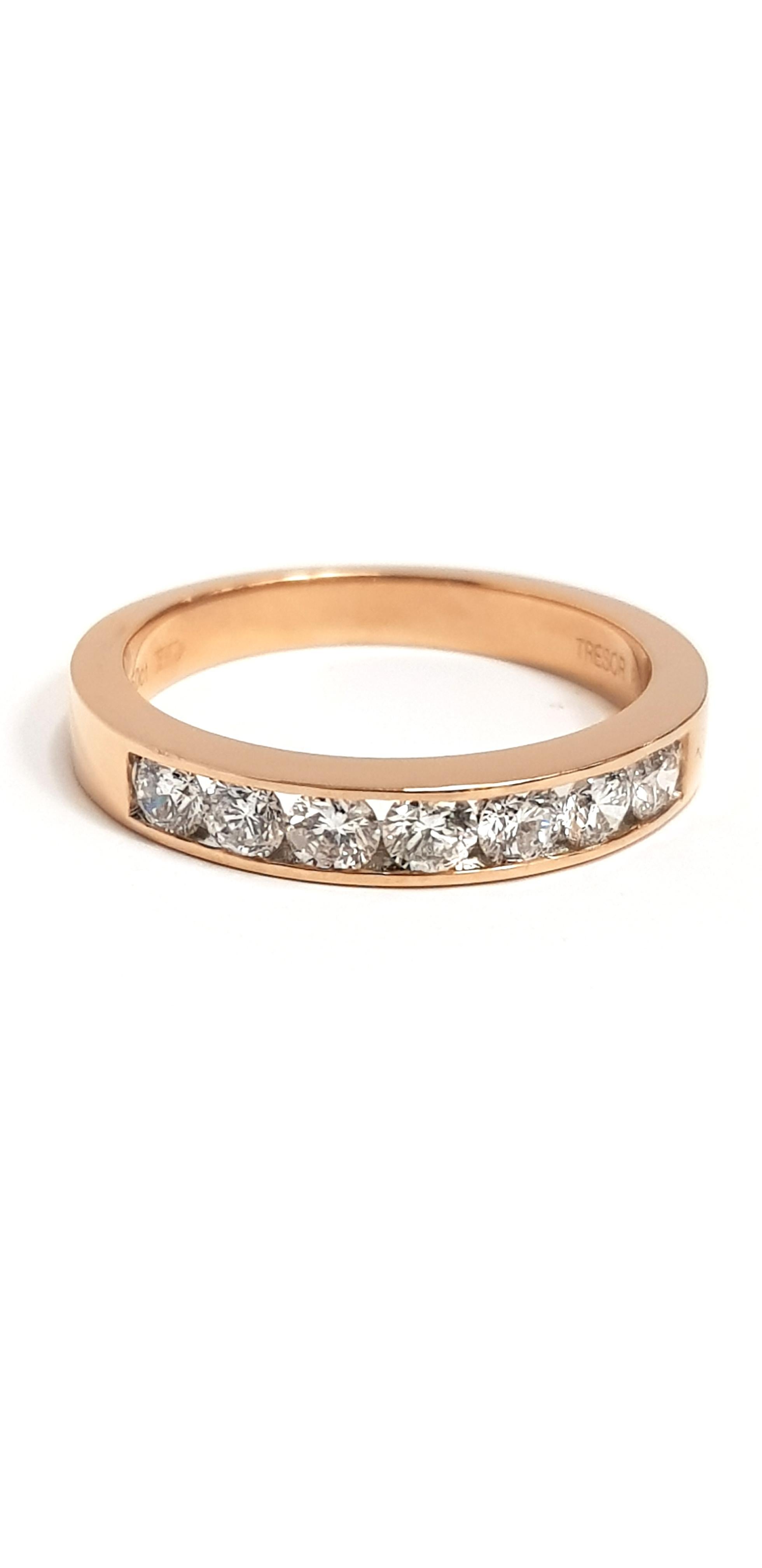 This channel set 18 Carat Rose Gold Half Eternity ring is an exquisite addition to our collection. A sparkling array of seven color H Clarity SI1 diamonds are White Round Cut which gives a classic and iconic look. This ring has a total diamond