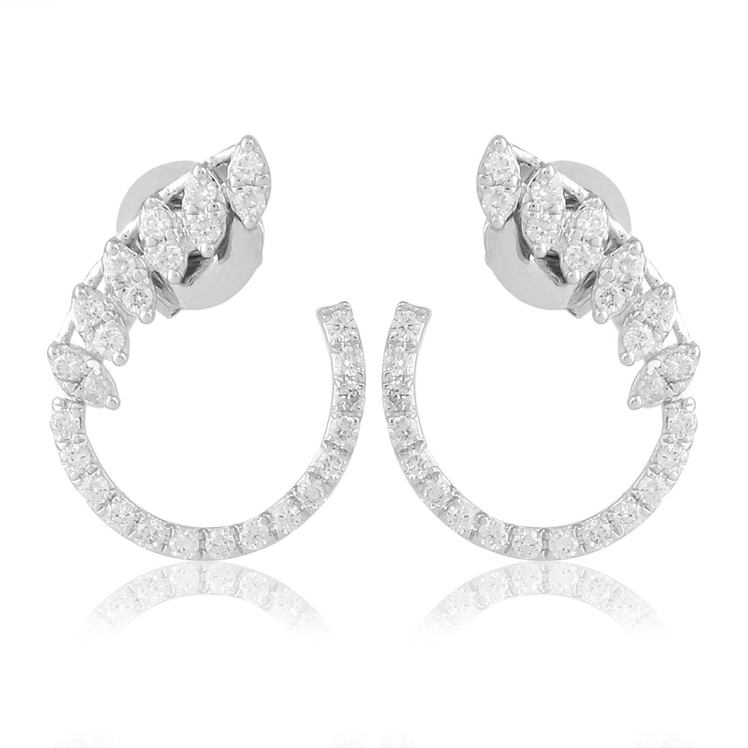 The sleek and minimalist design of these earrings accentuates the natural beauty of the diamonds, allowing them to take center stage. The lustrous 18 karat white gold settings provide the perfect backdrop, enhancing the brilliance of the diamonds