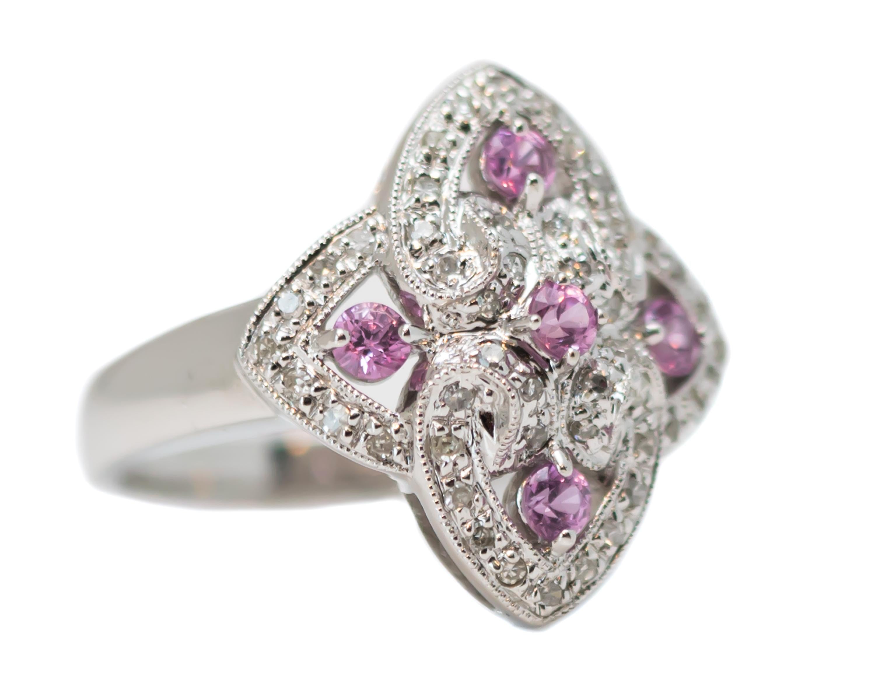 Pink Sapphire and Diamond Ring - 14 Karat White Gold, Pink Sapphires, Diamonds

Features: 
0.50 carat total Round Brilliant Diamonds
0.25 carat total Round Pink Sapphires
14 karat White Gold 
4-interlocking heart  design
5 pink sapphires surrounded